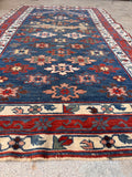 Vintage vegetable-dyed wool prayer rug measuring 3'3 by 5'9 with a floral border.