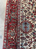 Heriz rug border with deep watermelon red and pistachio green tones.