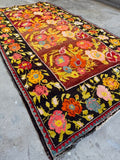 Vintage Karabagh 5x9 rug with oversized floral design and bright vegetable dyed wool.