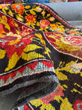 Texture closeup of vintage Karabagh rug highlighting dense handwoven wool pile.