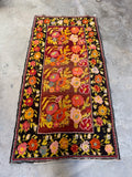 Vintage Karabagh wool rug 5x9 displaying bold floral composition and juicy dye tones.