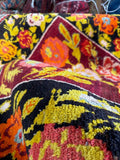 Vintage Karabagh floral rug in 5x9 size featuring chunky wool pile and saturated colors.