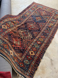 Antique Caucasian Kazak rug with bold tribal design and vegetable dyed wool.