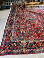 Soft wear patterns on a well-preserved Persian rug.
