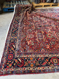 Soft wear patterns on a well-preserved Persian rug.