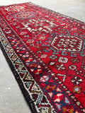 Decorative vintage persian runner side angle with ivory border