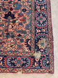 Distressed antique Persian rug surface shot showing timeworn wool loss and exposed foundation.