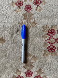 Vintage ivory Turkish rug with scattered distressing and minor wool loss showing authentic vintage character.