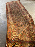 Vintage Persian runner, authentic Bakhtiari rug with handmade asymmetrical ends, low wool pile, vegetable dyed colors, and timeless geometric design.