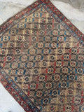 Antique Persian rug, authentic Bidjar Iron Rug of Persia with geometric star motifs, scattered wear, 100% wool construction, and rich vegetable dyed colors.