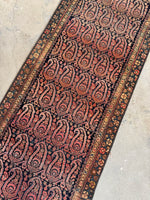 Rare handwoven Persian runner with strong visual contrast.