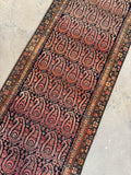 Rare handwoven Persian runner with strong visual contrast.