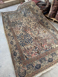 Vintage 1940 Persian rug featuring Birds of Paradise on an ivory ground.
