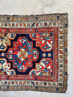 Wear at the ends of a 1920s Persian rug.