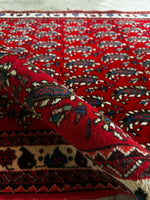 Well-preserved mid-century Persian rug with bold colors and textured pile.