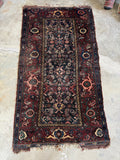 Small antique Persian rug with shabby chic character and sturdy village construction.