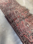 Vintage 1930s Persian runner with floral sprays and paisley border.