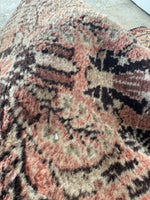 Close up view of narrow Persian runner from the 1930s with elegant patterns.