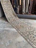 Extra long vintage runner with harmonious floral design.