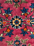 Persian Sarouk small rug featuring traditional botanical artwork and timeless natural dye colors.