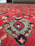 Antique Tabriz rug detail of floral vines and blossoms across the field.