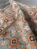 Finely woven antique Persian Tabriz rug with stout wool construction and elegant floral lattice design.
