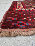 Antique tribal bag face wall hanging featuring traditional geometric göl motifs framed by geometric borders.