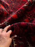 Soft, low pile texture of a vintage wool Afghani rug.
