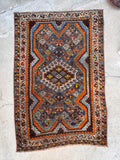 Hand-knotted Shiraz scatter rug ideal for colorful entryway or small space styling.
