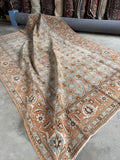 7x10 antique Persian Tabriz rug featuring a soft powder blue field, terracotta border, and repeating floral lattice pattern.