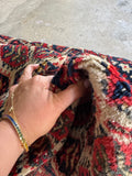 Vintage wool scatter mat with dense allover boteh motif and soft tactile feel.