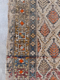 Late 19th century rug featuring natural vegetable dye abrash and intricate geometric borders.