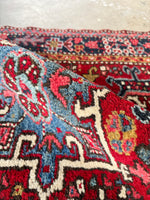 antique Persian scatter rug with tribal medallions and bold colors 