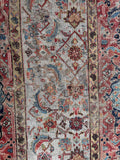 Rare antique Sultanabad Mahal runner showcasing a Herati water garden design in soft light blue tones.