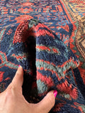 Luxurious wool Kurdish rug with deep natural colors.