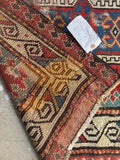 Collectible antique prayer rug with hand knotted wool, symbolic tribal design and century-old patina.