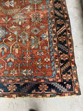 Corner view of a durable Heriz rug with bold motifs