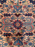 Vintage Northwest Persian Heriz rug close up view displaying crisp geometric botanical themed designs.