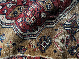 3x4 antique tribal rug with camel, madder red and indigo colors