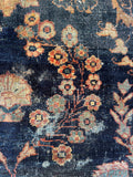 Close up of antique Mahal rug showing vegetable dyed wool and wear.