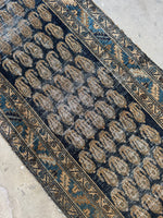 Persian runner featuring warm wheat, ocean blue, and caramel accents.