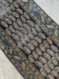 Persian runner featuring warm wheat, ocean blue, and caramel accents.