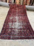 Worn vintage Persian rug 