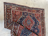 Antique Persian tribal rug