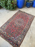Small antique Persian rug