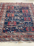 small worn vintage navy blue and brick red persian rug Blue Parakeet Rugs